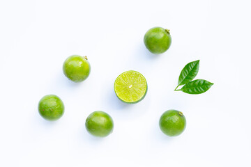 Limes with leaves isolated on white.