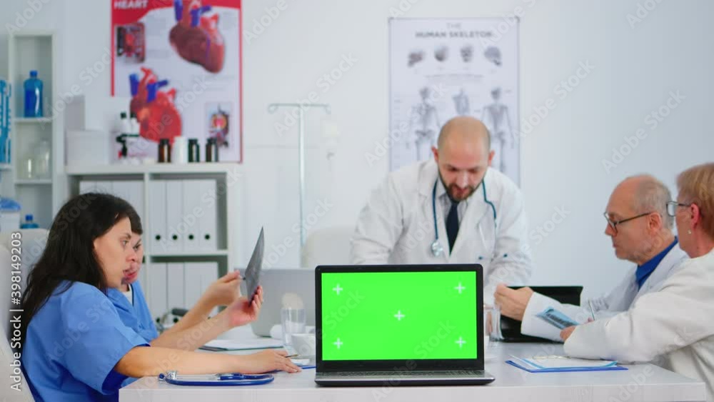 Aufkleber medical colleagues working in hospital conference room analysing patients reports placing laptop wit