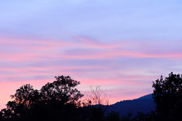 Fototapeta na wymiar Beautiful twilight sky with cloud after sunset above the hill and trees