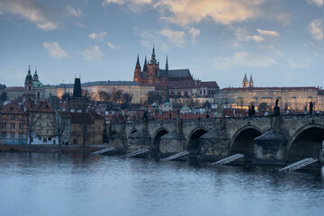 Fototapeta na wymiar . prague castle and charles bridge and st. vita church lights from street lights are reflected on the surface of the vltava river in the center of prague at night in the czech republic