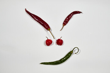 Vegetable chilli, chile face on white backgroung