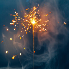 fire sparkler in dense smoke, abstract Christmas firework background