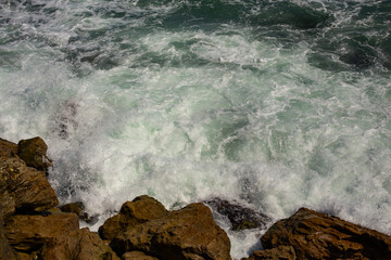 Waves during a storm. View from above. Red code. Rest on the Black Sea coast in Bulgaria. Elemental force.