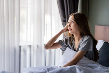 Beautiful long hair women wake up from the bed.