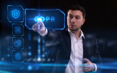 Business, Technology, Internet and network concept. Young businessman working on a virtual screen of the future and sees the inscription: GDPR