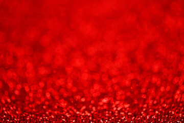 Bokeh abstract background, red defocused texture for Christmas greeting card, crimson holiday background, New Year advertising poster etc.