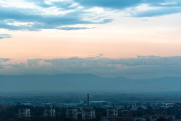 Sunset over polluted smog city environmental question conversation concept ecology nature Plovdiv, Bulgaria