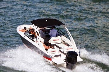 Group cruising on Biscayne Bay in a high-end runabout motorboat.
