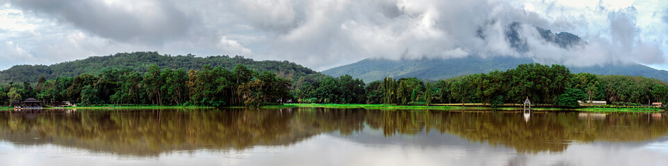 Panorama green tree and shadow on the river with blue sky clouds, Green mountain with blue sky clouds after rain