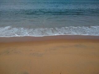 Fototapeta na wymiar waves on the Sandy beach seascape view