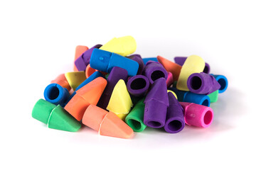 Pile of multicolored rubber pencil topper erasers yellow blue purple pink