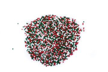 Pile of Red white and green colored candy sprinkles top down view