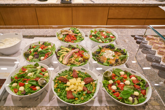 MILAN, ITALY - CIRCA NOVEMBER, 2017: salads on display at Farini in Milan. Farini is modern bakery which offers Italian pastry, salads, bowls and pizza