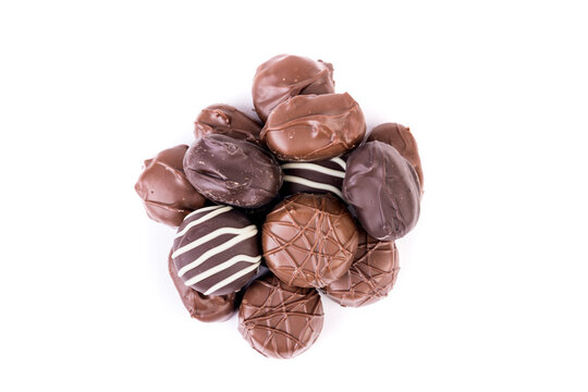 Ten Pieces Of Milk And Dark Striped Chocolates In A Pile Top Down View