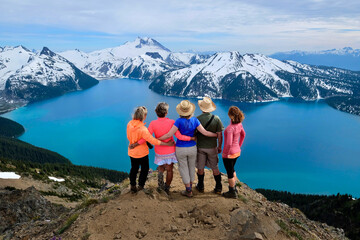 Group of friends on mountain top looking happy, energetic and successful.  Garibaldi Provincial Park. British Columbia. Canada 