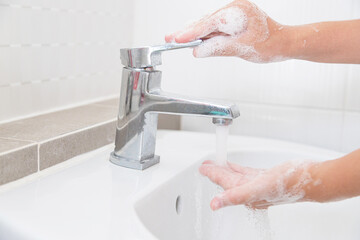 Washing your hands with soap for cleaning helps prevent germs