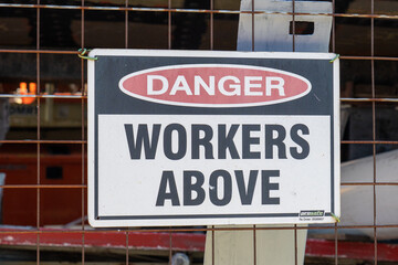 Fototapeta na wymiar Sign on construction site saying 