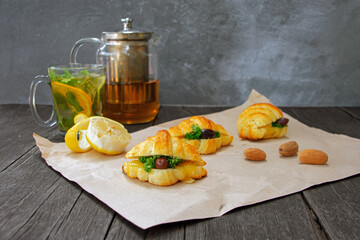 Freshly baked croissants on a plate, dark background, copy space