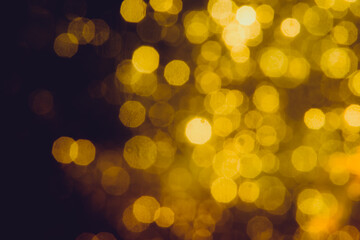 Abstract decorat  bokeh holiday christmas glowing lights on black