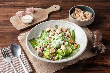 Caesar salad on Wooden Table.