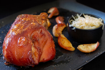 Bavarian style Pork Knuckle with Sauerkraut and baked apple