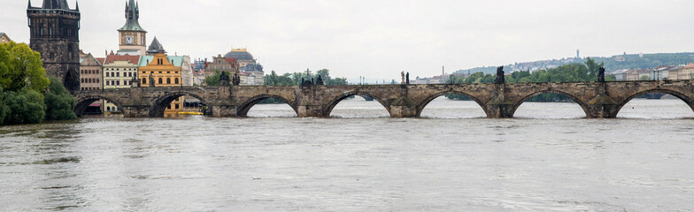 Obraz na płótnie Canvas View of the Vltava River and Charles Bridge during the 2013 floods in Prague