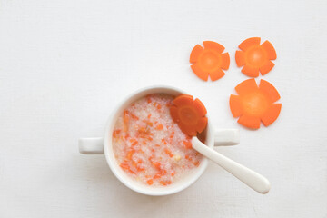 mix rice gruel and carrot healthy foods health care for baby eats breakfast  decoration flat lay...