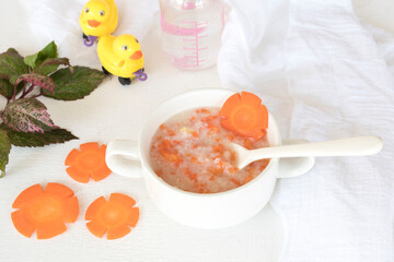 mix rice gruel and carrot healthy foods health care for baby eats breakfast with duck toy...