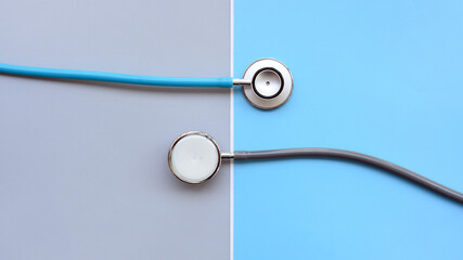 close up of stethoscope on gray and blue background     