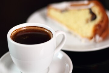 Coffee cup and cake with sugar icing