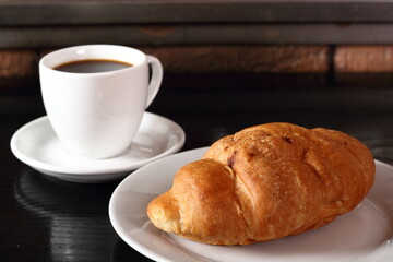 Croissant and coffee cup