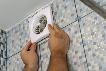Fototapeta the master removes the grate very dirty Exhaust fan in the bathroom obraz