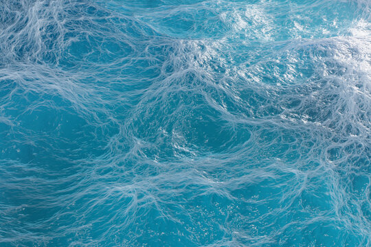3d illustration. Part of the ocean with the color green and blue with waves on the surface. © Luca9257