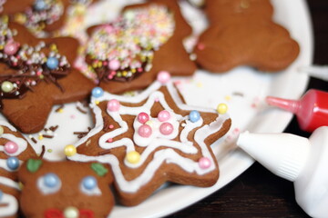 Decorating cookies with icing tube. Making Gingerbread Cookies Series.