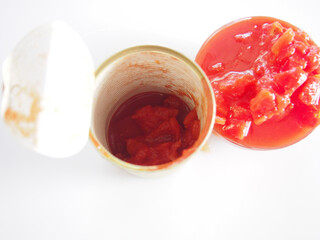 Canned tomatoes in can and in bowl