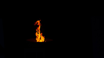 Orange and yellow fire over black 