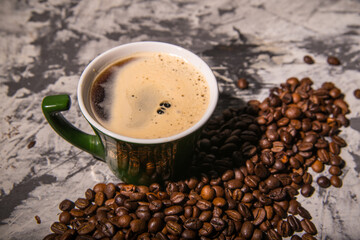 Coffee mug with coffee beans, close-up, space for text
