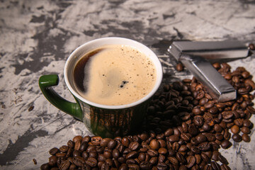 Coffee mug with coffee beans with chocolate pieces, close-up, space for text