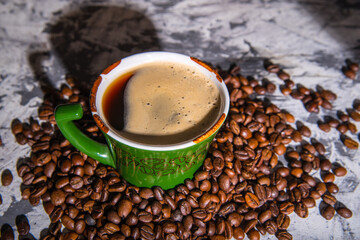 Coffee mug with coffee beans, close-up, space for text