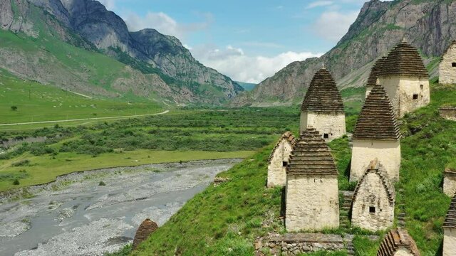 Aerial view of Dead Town Dargavs In North Ossetia. The ancient cemetery of the Alans. Many small stone mausoleums, 4k