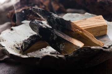 Smudging ceremony using Peruvian Palo Santo holy wood incense stick
