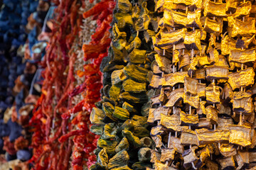 Bundles of sun dried vegetables hanging up at Turkish bazaar