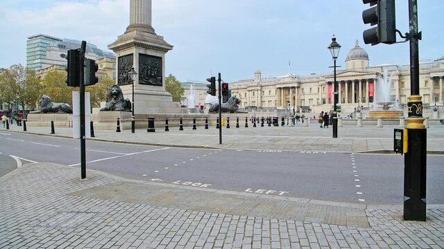 Quiet, empty streets in London with no cars or traffic during Coronavirus Covid-19 pandemic lockdown at Trafalgar Square and Nelsons Column in London in the City of Westminster, England, UK