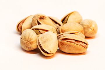 a pile of pistachios on a white background