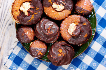 Close up of many delicious marshmallows on a plate on a blue and white napkin. Top view