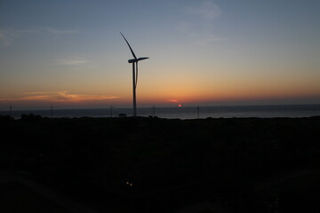 wind turbine at sunset