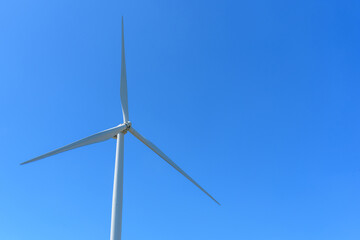 wind turbines park for make the electric power from wind with blue sky