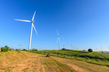 wind turbines park for make the electric power from wind with blue sky