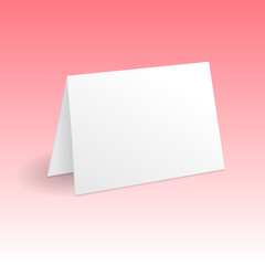 Obraz na płótnie Canvas White standing greeting card mockup template. Isolated on gradient pink background with shadow.