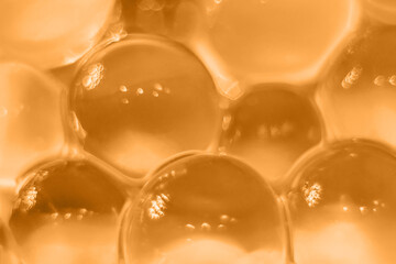 Abstract orange texture, crystalline balls of hydrogel for the background. Hydrogel beads. Close up...